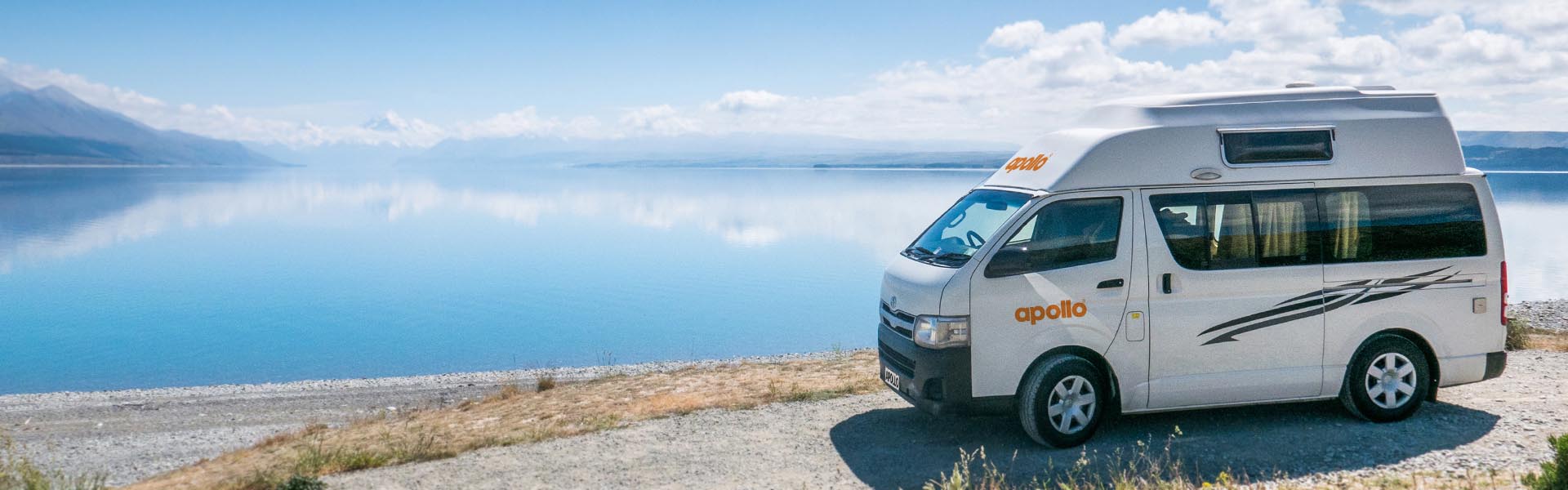 Apollo camper next to lake in New Zealand