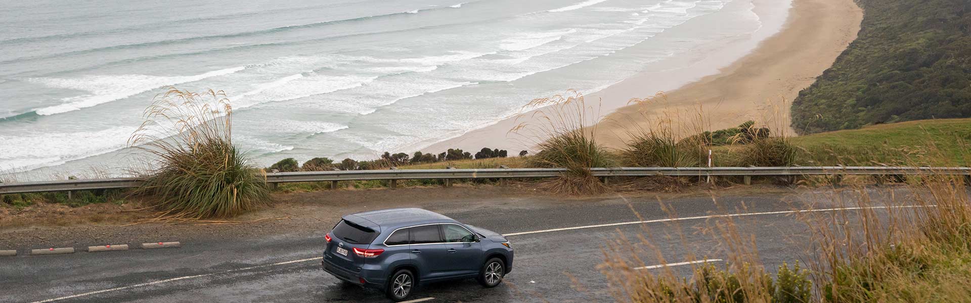 Toyotal rental car driving near ocean Image Credit: Graeme Murray
