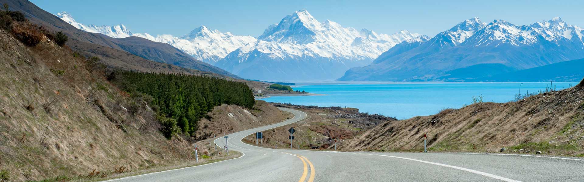 New Zealand road close to lake and mountains Image Credit: Paul Lemlin