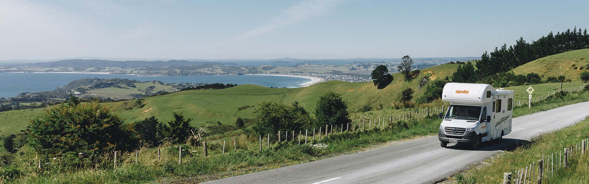 Apollo motorhome driving nearby Auckland, New Zealand